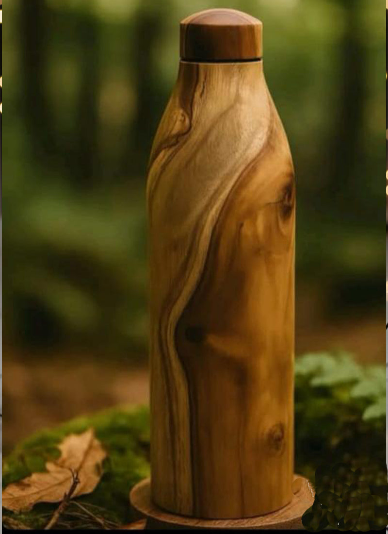 Wooden water bottle with a natural grain pattern on a blurred green background
