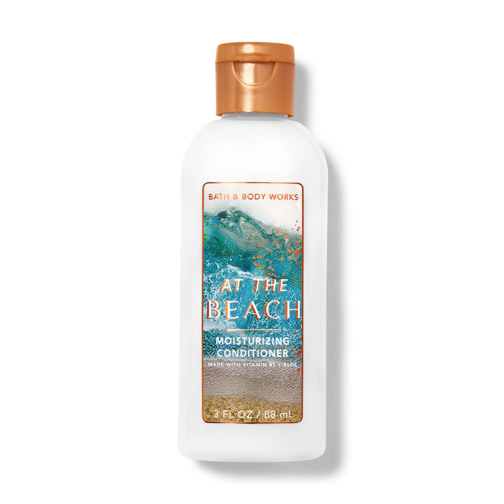Bath & Body Works conditioner bottle labeled 'At the Beach' on a white background