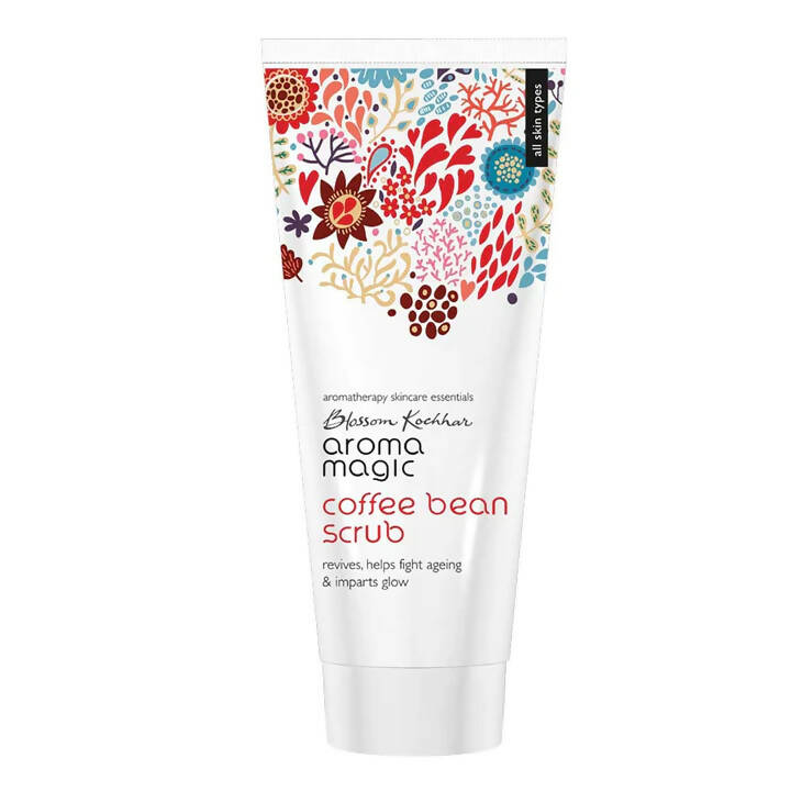 Tube of Aroma Magic coffee bean scrub with floral design on a white background