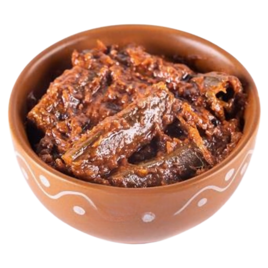 Ceramic bowl with a dark brown spread on a white background