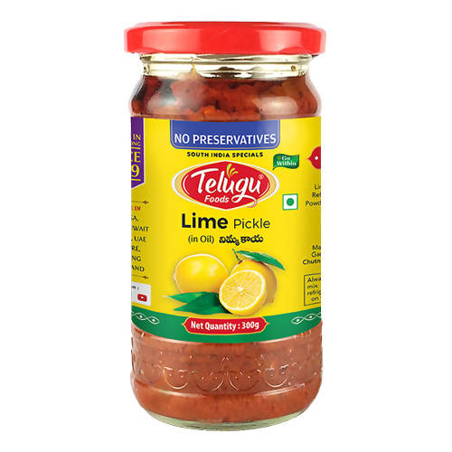 Jar of Telugu Lime Pickle with a red lid on a white background
