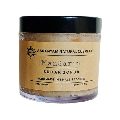 Aaranyam Mandarin Sugar Scrub packaged in a clear jar with a black lid and a label that reads 'Mandarin Sugar Scrub, handmade in small batches, net weight 120g'.