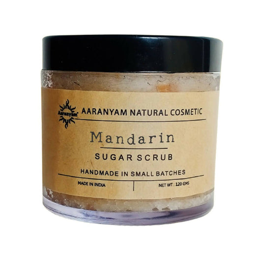 Aaranyam Mandarin Sugar Scrub packaged in a clear jar with a black lid and a label that reads 'Mandarin Sugar Scrub, handmade in small batches, net weight 120g'.