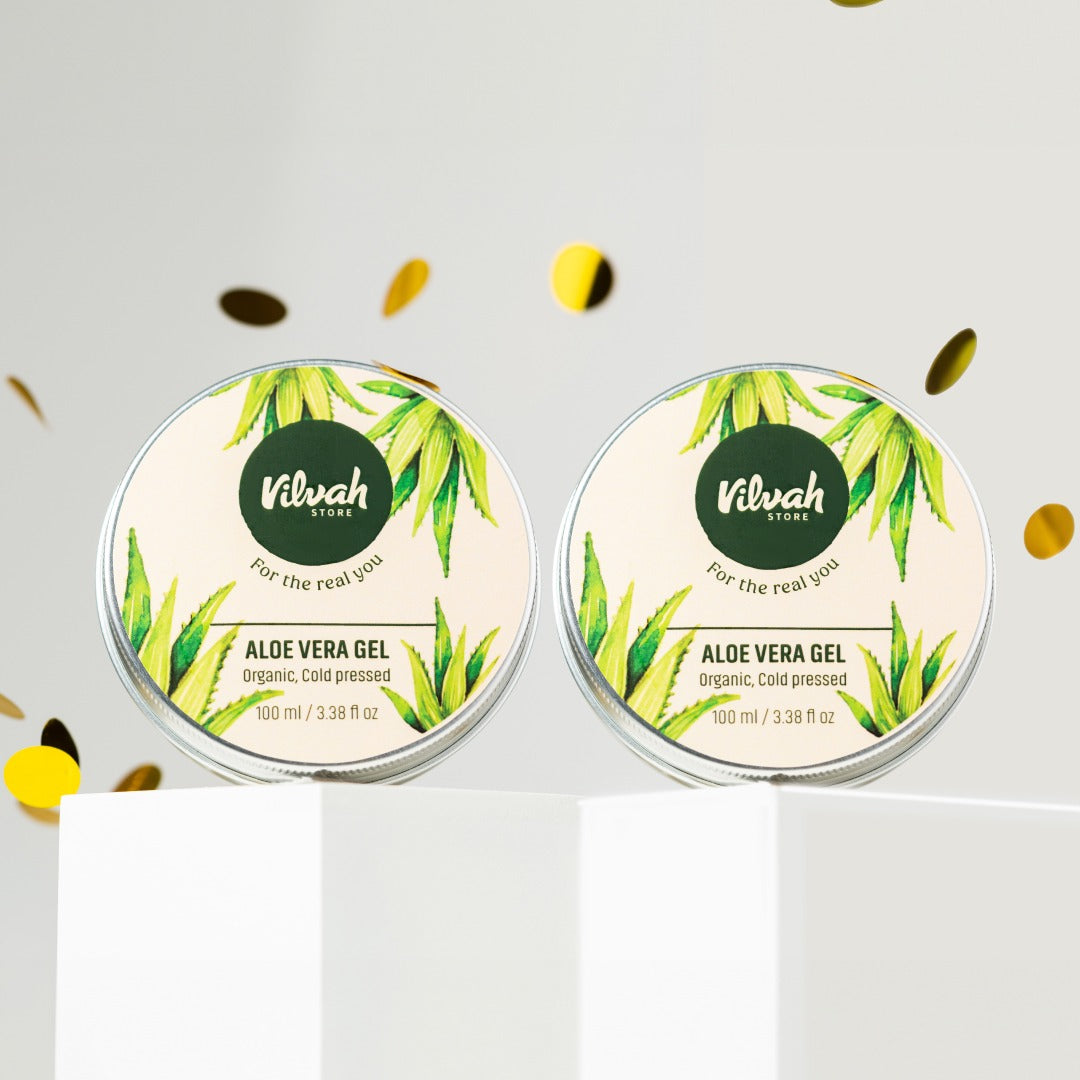 Two containers of Nilvah Aloe Vera Gel on a white background with gold confetti.