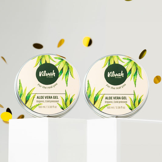 Two containers of Nilvah Aloe Vera Gel on a white background with gold confetti.