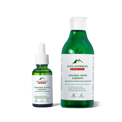 Two green bottles with white labels on a white background, featuring the brand 'Alps Goodness'.