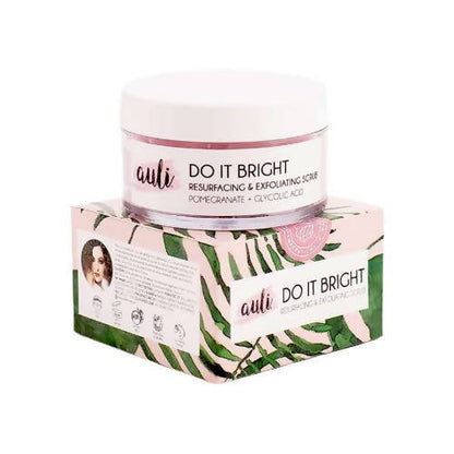 Auli Do It Bright AHA 5% Exfoliating Face Scrub jar on top of its packaging box. The packaging has a green and pink design with leaves and text.