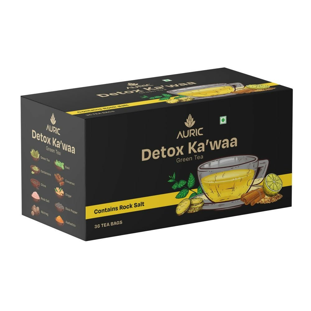 Box of Auric Detox Ka'waa Green Tea with images of tea bags and spices on the front, alongside a cup of brewed tea.