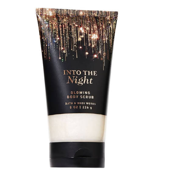 Tube of 'Into the Night' glowing body scrub with decorative label on a white background