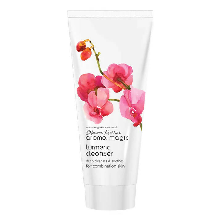 Tube of Aroma Magic turmeric cleanser with floral design on a white background