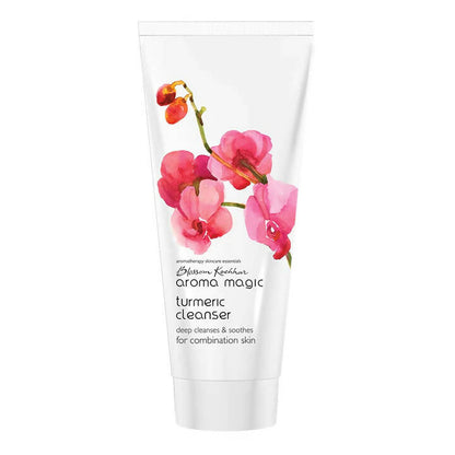 Tube of Aroma Magic turmeric cleanser with floral design on a white background
