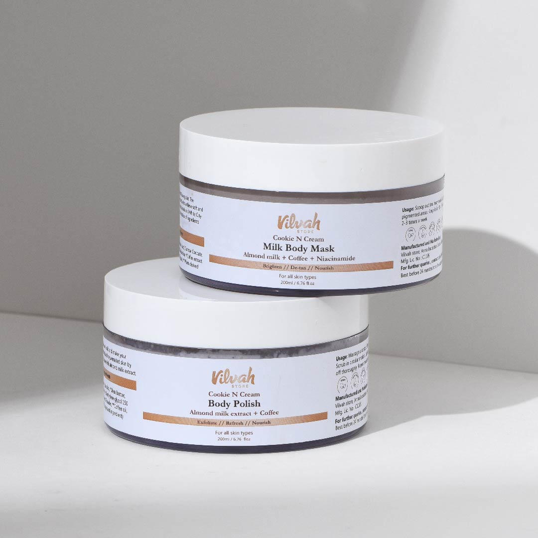 Two white jars with labels on a light gray background
