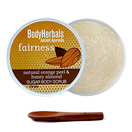 BodyHerbals fairness natural orange peel & honey almond sugar body scrub with a wooden scoop on a white background