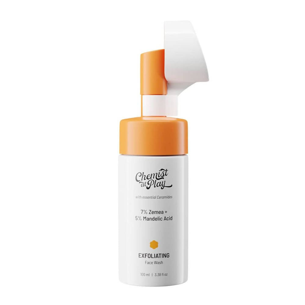 Chemist At Play Exfoliating Face Wash bottle with a pump dispenser, orange and white label, and a built-in soft brush.