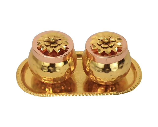 Two gold-colored metal cups with a tray on a white background