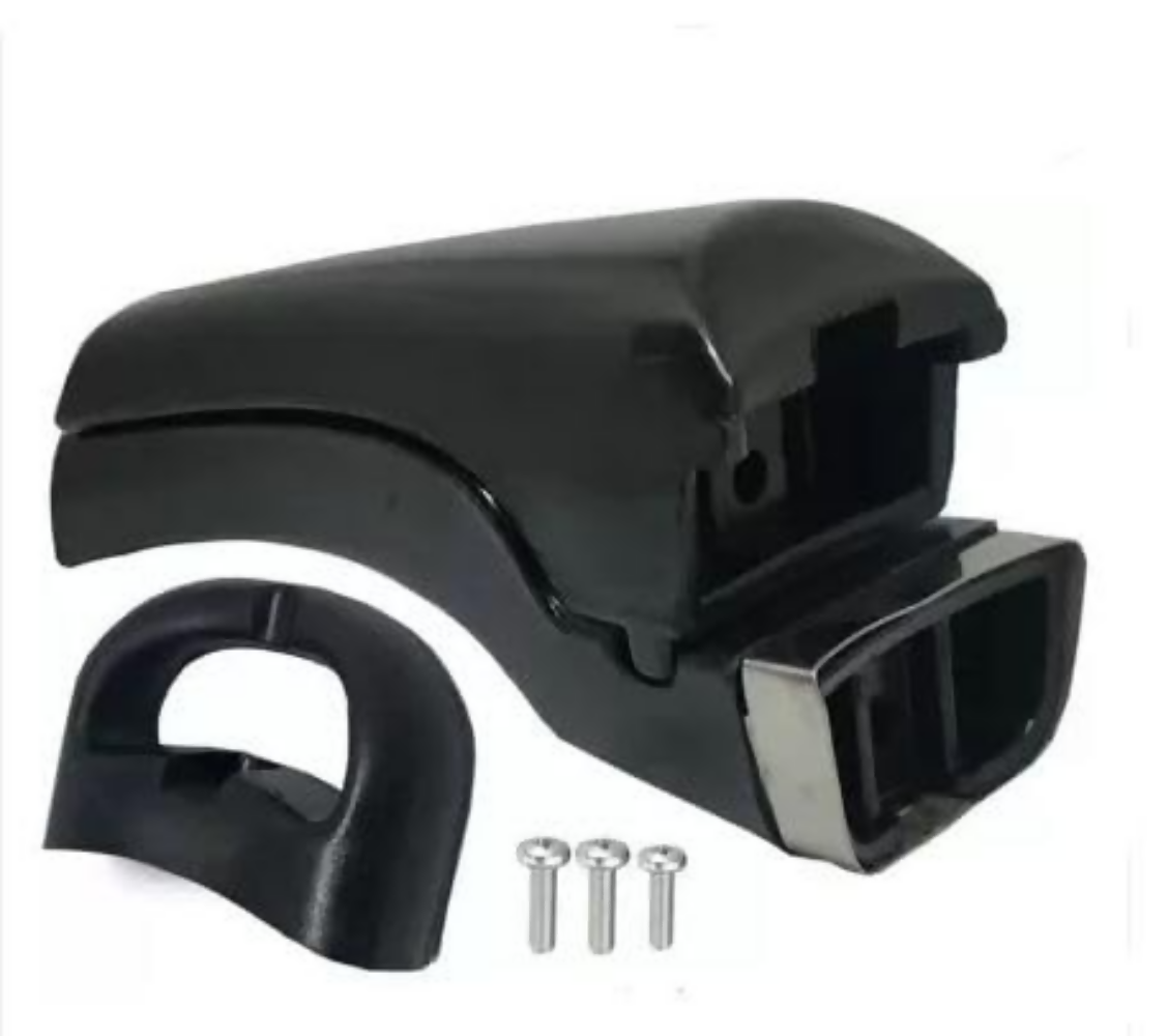 Black plastic car part with chrome accents and screws on a white background