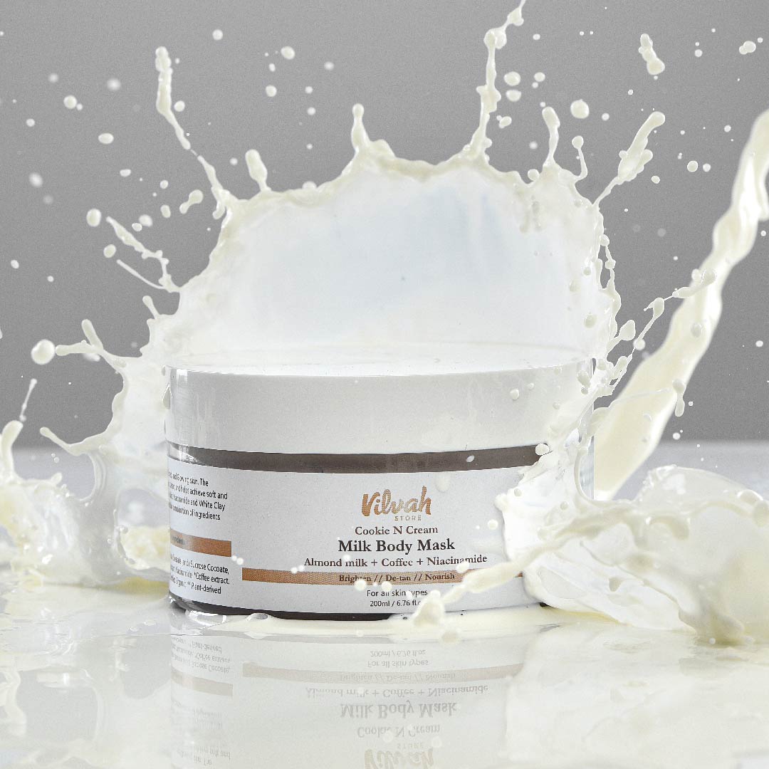 Jar of milk body mask with splashes on a gray background