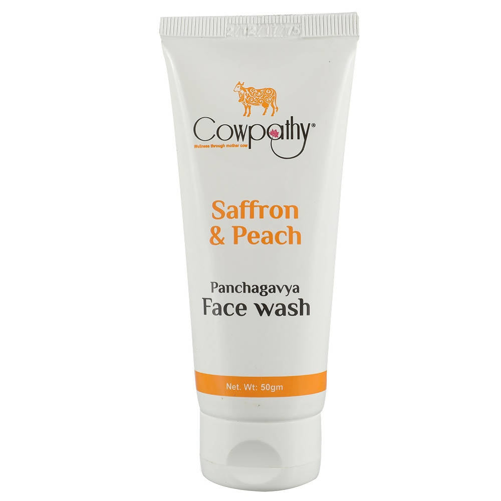 A tube of Cowpathy Saffron & Peech Panchagavya Face Wash against a white background.