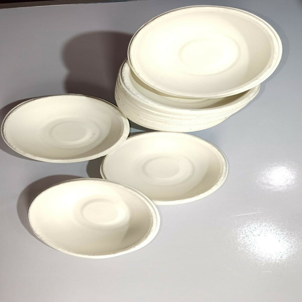 Set of white ceramic bowls on a gray surface