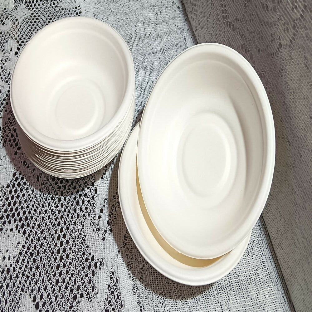 Stack of white ceramic bowls on a textured surface