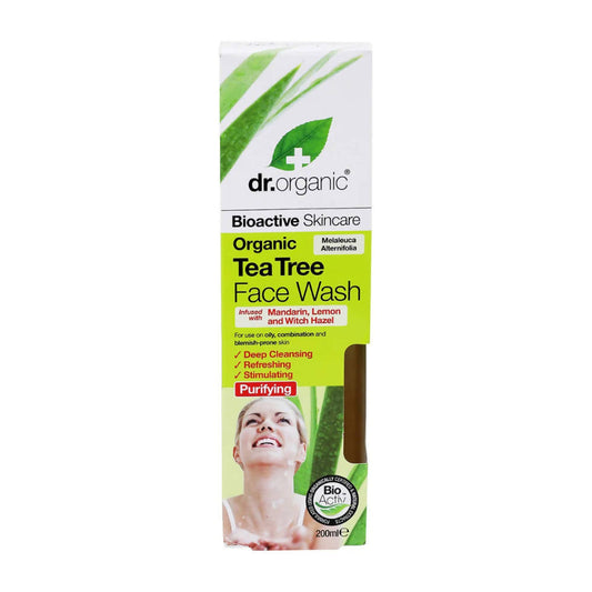 Packaging of Dr.Organic Tea Tree Face Wash with green and white color theme, featuring an image of a person using the product and highlighting organic and purifying attributes.