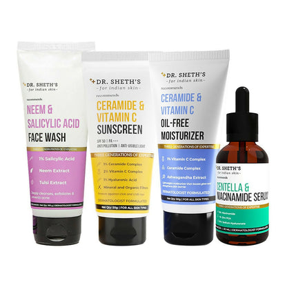 Set of Dr. Sheth's skincare products including face wash, sunscreen, moisturizer, and serum on a white background.