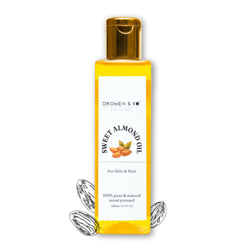 Bottle of sweet almond oil with a white label on a white background