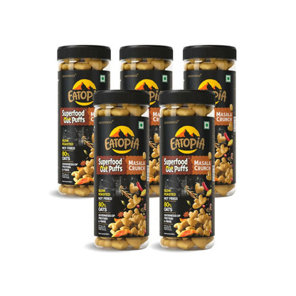 Multiple jars of Eatopia Superfood Oat Puffs and Masala Crunch on a white background