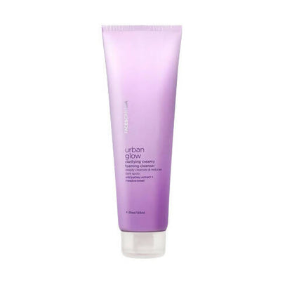 A tube of Faces Canada Urban Glow Clarifying Creamy Foaming Cleanser against a white background.