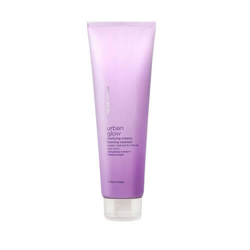 A tube of Faces Canada Urban Glow Clarifying Creamy Foaming Cleanser against a white background.