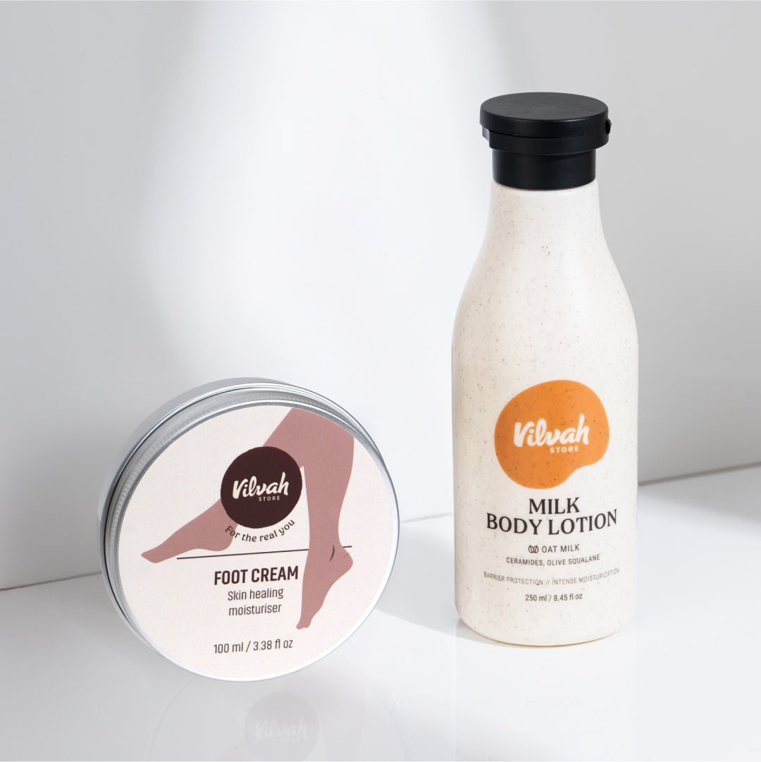 Vilvah foot cream and milk body lotion on a white background