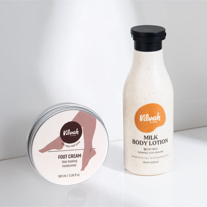 Vilvah foot cream and milk body lotion on a white background