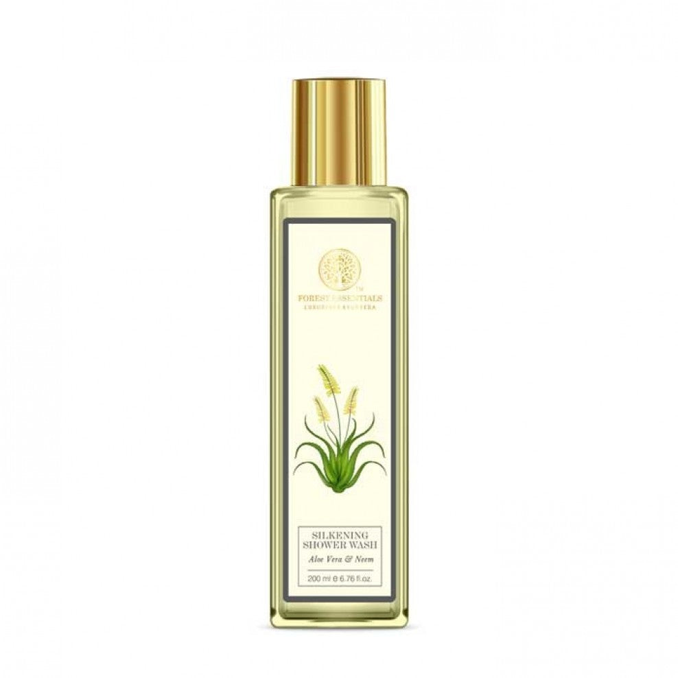 Gold bottle with a label featuring a plant design on a white background