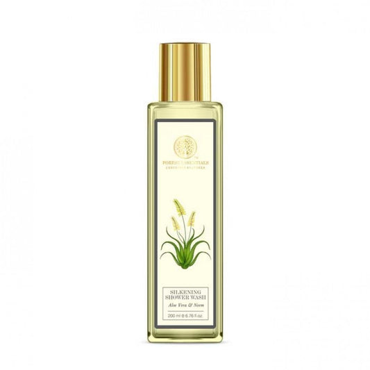 Gold bottle with a label featuring a plant design on a white background