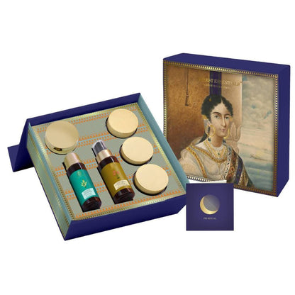 Cosmetic set with bottles and cream in a decorative box featuring an portrait on the lid.