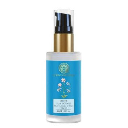 Skincare bottle with blue label and gold cap on white background