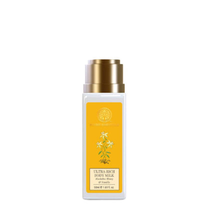 Body milk bottle with gold cap on a white background