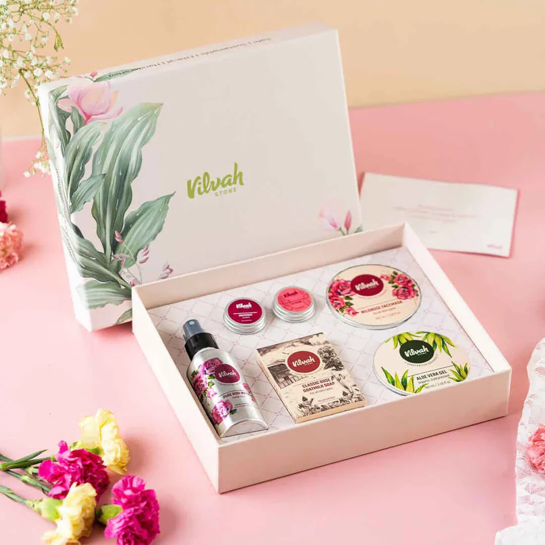 Vilvah Cosmetics product set with various items on a pink background