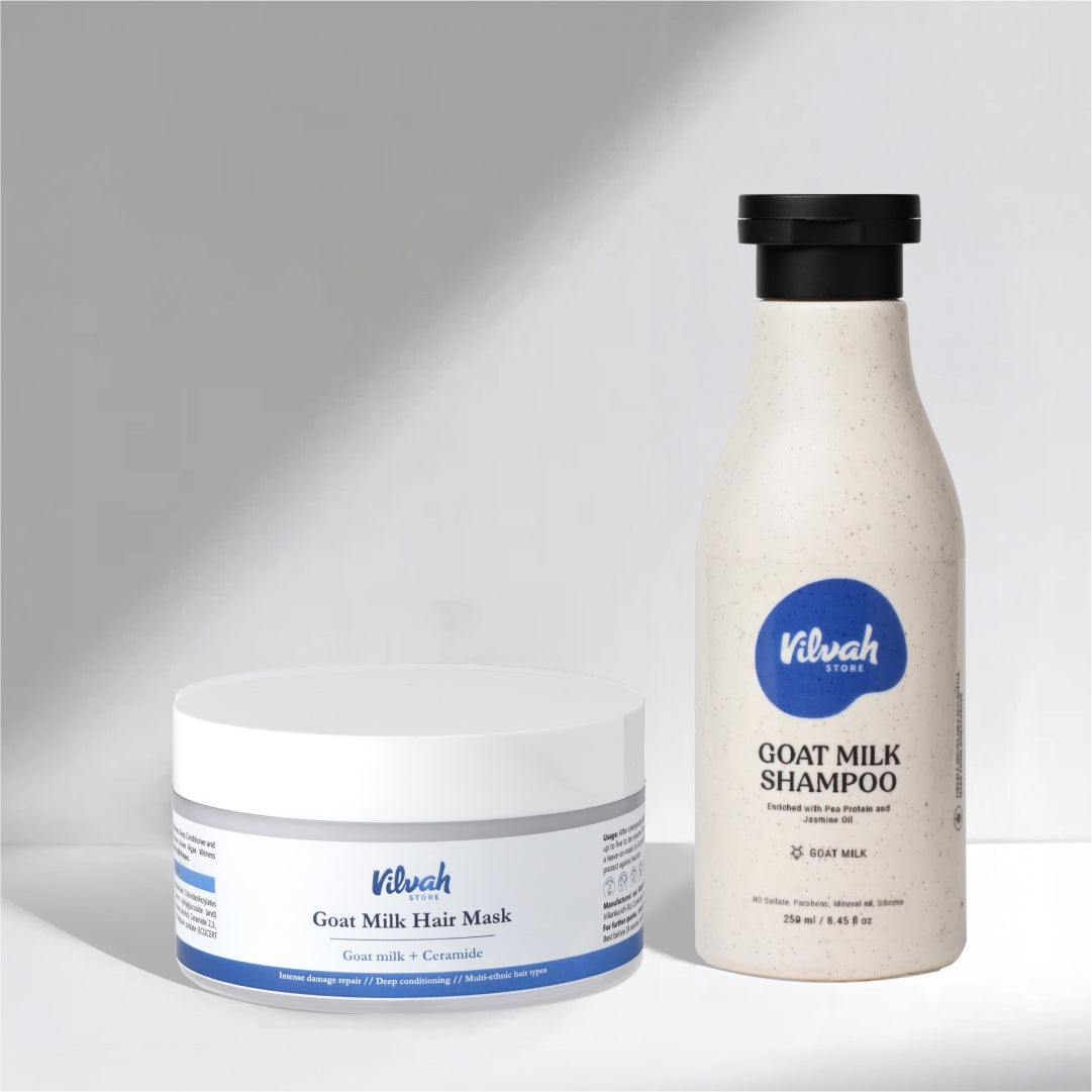 Vilvah goat milk hair mask and shampoo on a gray background