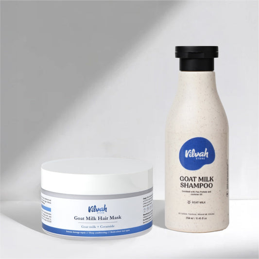 Vilvah goat milk hair mask and shampoo on a gray background