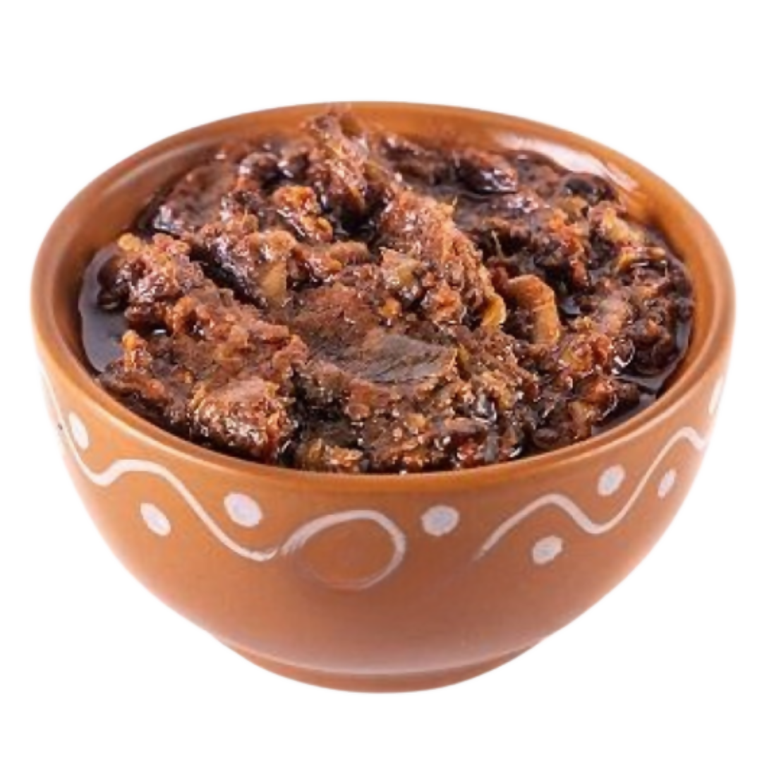 Ceramic bowl with a dark brown spread on a white background