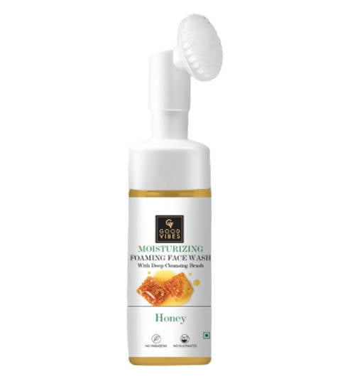 Moisturizing foaming face wash bottle with honey label on a white background