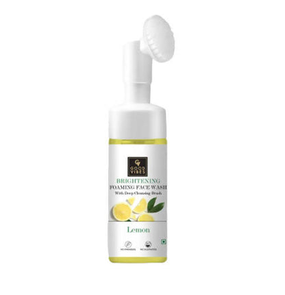 Brightening foaming face wash with lemon and green leaf design on a white background