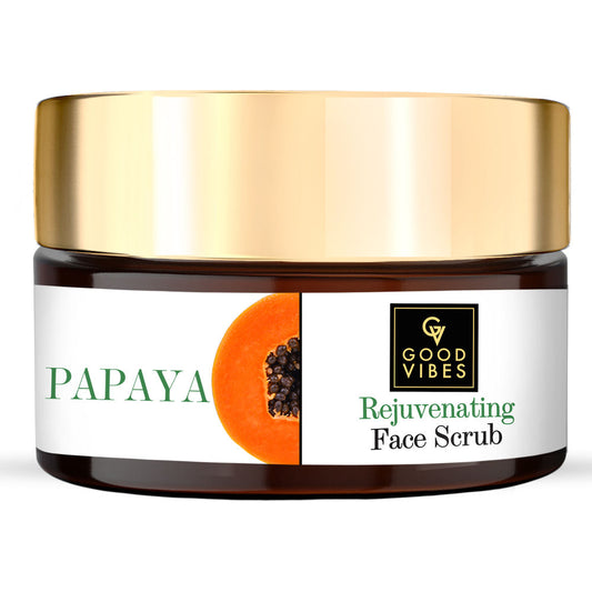 Papaya rejuvenating face scrub jar with gold lid on a white background