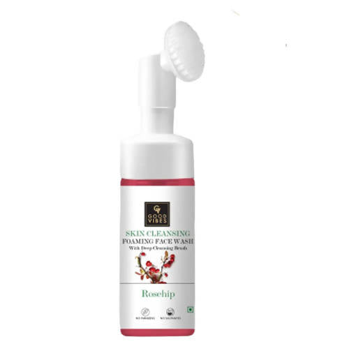 Skin cleansing foam face wash bottle with brush on a white background