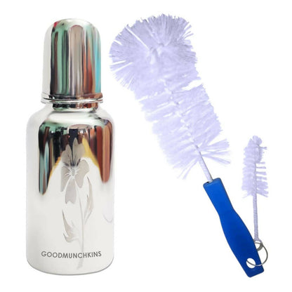 Bottle with silver cap and white design, accompanied by a cleaning brush with a blue handle on a white background.