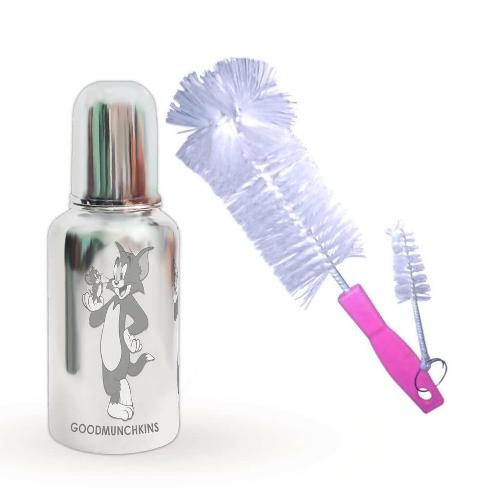 Silver bottle with engraved character and cleaning brush on a white background