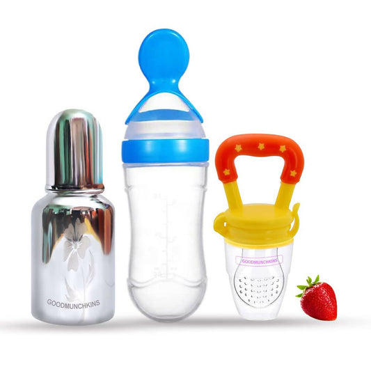 Three baby feeding products with a strawberry on a white background