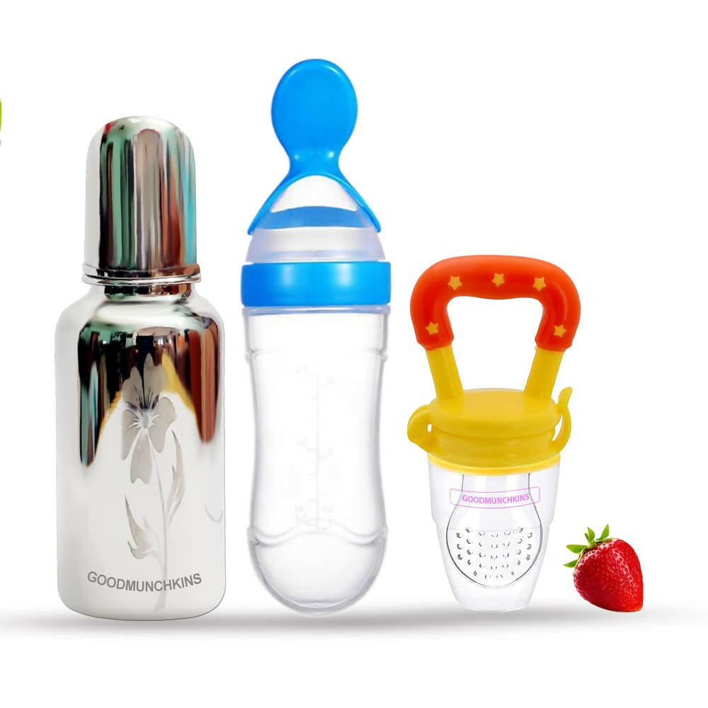 Three baby feeding products with a strawberry on a white background