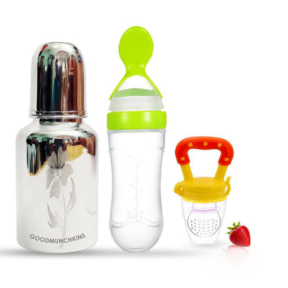 Baby feeding products including a bottle, spoon, and pacifier on a white background.